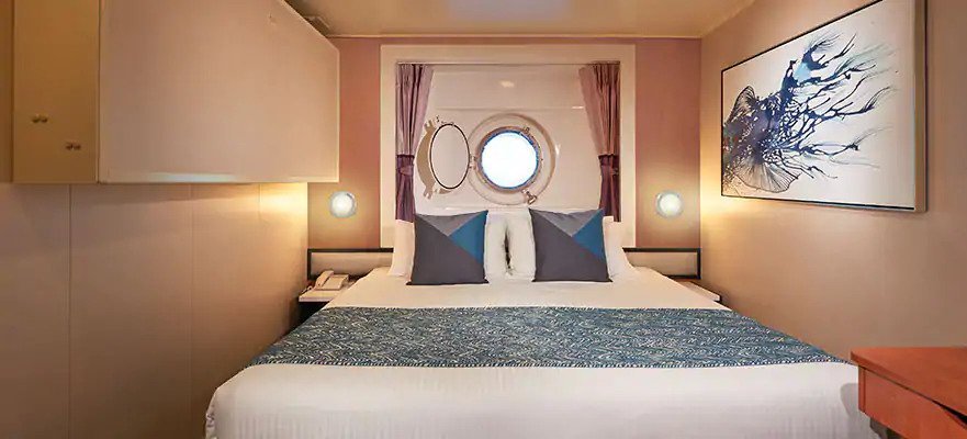 Каюта с окном "Mid-Ship Oceanview Porthole Window Stateroom"